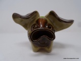 POTTERY PIGGY BANK; BROWN AND TAN IN COLOR AND STANDS 5 IN TALL