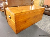 PINE CHEST; LARGE DOVETAILED CHEST WITH WROUGHT IRON HANDLE. MEASURES 56 IN X 24 IN X 25 IN. HAS 2
