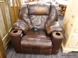 OKIN LEATHER LIFT CHAIR; HAS POWER ADAPTER AND DUAL CUP HOLDERS (1 ON EITHER ARM). HAS SOME WEAR ON