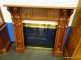 MAHOGANY FIREPLACE MANTLE; HAS CUBE PATTERNED BACK AND REEDED SIDES. MEASURES 38 IN X 15 IN X 50 IN