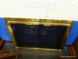 BRASS AND GLASS FIREPLACE DOOR INSERT; HAS PIERCED EDGING AROUND THE TOP AND BOTTOM. MEASURES