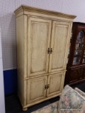 ENTERTAINMENT/GENTLEMAN'S ARMOIRE; YELLOW IN COLOR WITH 4 DOORS WITH BRONZE TONED PULLS. SITS ON BUN