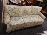 CRAFTMASTER FLORAL 3 CUSHION SOFA; GREEN, BLUE, AND PINK IN COLOR. SHOWS LITTLE TO NO WEAR. 83 IN X