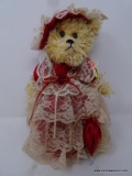 (DIS) VICTORIAN TEDDY BEAR FIGURINE; PLUSH TAN BEAR DRESSED IN VICTORIAN FINERY MADE OF RED SATIN