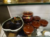 (DIS) POTTERY LOT; HULL POTTERY BEAN POT, 4 BROWN GLAZED POTTERY BEAN BOWLS, AND A DIVIDED PEAR