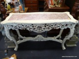 WHITE CARVED SOFA TABLE WITH MARBLE INLAY TOP; BOWED EDGE TOP SURFACE WITH A MAUVE COLORED