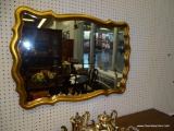 GOLD TRIMMED WALL MIRROR; MOLDED EDGE IN A SCALLOPED RECTANGULAR PATTERN AND SHAPE. DEEP RICH GOLDEN
