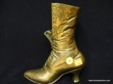 SOLID BRASS VICTORIAN BOOT FIGURINE; STANDS ABOUT 8 IN TALL AND 7 IN WIDE.
