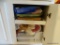 (KIT) CABINET LOT- TO INCLUDE, DISH CLOTHS, PLATE HOLDERS, 2 SERVING TRAYS, BASKETS AND DRAWER