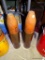 (DEN) PAIR OF WWII 105MM SHELLS WITH WOODEN CARVED HEADS: 22 IN TALL
