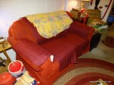 (DEN) RED UPHOLSTERED SOFA- HAS A STAIN- 66