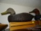 (DUCK) HAND CARVED DUCK DECOY: 16 IN LONG. GRAY AND BLUE IN COLOR.