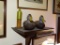(DUCK) WOODEN WALL SHELF: 12 IN X 8 IN X 8 IN WITH CONTENTS: PAIR OF SIGNED DUCK FIGURINES (1988)