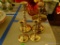 (BED1) LOT OF 4 BRASS CANDLESTICK HOLDERS. TALLEST: 7.5 IN TALL