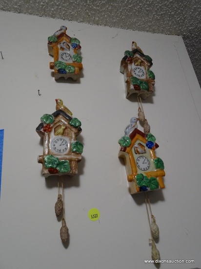 (UHAL) LOT OF 4 CUCKOO CLOCK THEMED WALL POCKETS WITH A DIFFERENT COLORED BIRD ON EACH WALL POCKET