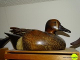 (DUCK) CARVED DUCK DECOY. IS SIGNED BY THE ARTIST 