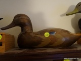 (DUCK) HAND CARVED DUCK DECOY: 14 IN LONG. BROWN IN COLOR.