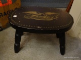 (BED1) VINTAGE BLACK AND TOLE PAINTED STOOL WITH EAGLE AND AMERICAN SHIELD PATTERN: 15 IN X 10.5 IN