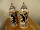 (BED1) 2 GOEBEL HUMMEL FIRST EDITION BEER STEINS: 11 IN TALL.
