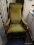 (BED1) VINTAGE ROCKING CHAIR WITH GREEN UPHOLSTERY AND MAHOGANY FRAME: 23 IN X 37 IN X 38 IN