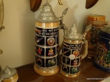 (BED1) LOT OF 2 BEER STEINS WITH VARIOUS IMAGES WITH THEIR NAMES. TALLEST: 9 IN TALL. BOTH ARE MADE