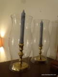 (BED1) 2 BRASS CANDLESTICK HOLDERS WITH HURRICANE SHADES. 1 IS MADE BY BALDWIN