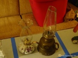 (BED1) 2 OIL LAMPS: 1 WITH PURPLE FLOWER PATTERN AND 1 WITH METAL BASE AND OBLONG CHIMNEY