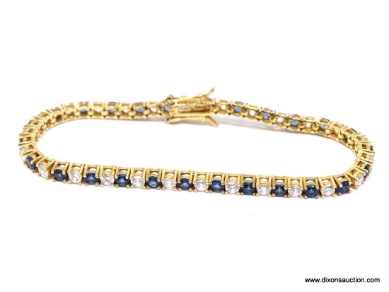 Outstanding 7 1/2" .926 gold vermeil tennis bracelet with blue and white CZ's. This bracelet is