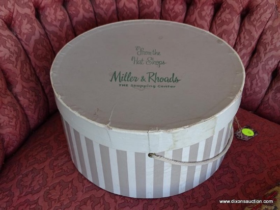 VTG MILLER & RHOADS HATBOX; SMALL SIZE, ROUND WITH LID AND ROPED HANDLES. WRITING ON TOP IN GREEN