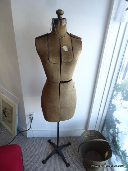VINTAGE DRESS FORM; UPHOLSTERED GREYISH-TAN FABRIC COVERED BODY WITH 10 ADJUSTABLE PANELS, AN IRON