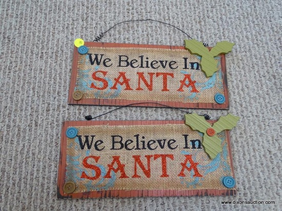 PAIR OF SANTA SIGNS; 2 RECTANGULAR SIGNS COVERED IN BURLAP ACCENTS AND IN TRADITIONAL RED AND GREEN,