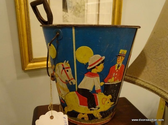 1920'S TIN SAND PAIL AND SHOVEL SET; HAS ORIGINAL IMAGE AS WELL AS HANDLE, RETAILS FOR $75.