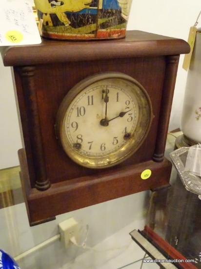 ANTIQUE MANTEL CLOCK; WOODEN CASE, HAS KEY, MADE BY SESSIONS CLOCK COMPANY. VALUED AT $75.