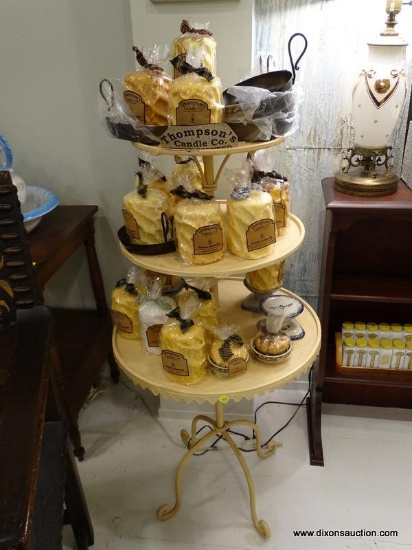 3 TIERED METAL DUMBWAITER STYLE SHELF; YELLOW-BEIGE IN COLOR, WITH A BIRD SHAPED FINIAL AT THE TOP