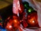 OVERSIZED RED BALL SHAPED ORNAMENTS LOT; BAG CONTAINING 4 BALL ORNAMENTS MEASURING ALMOST 10 IN