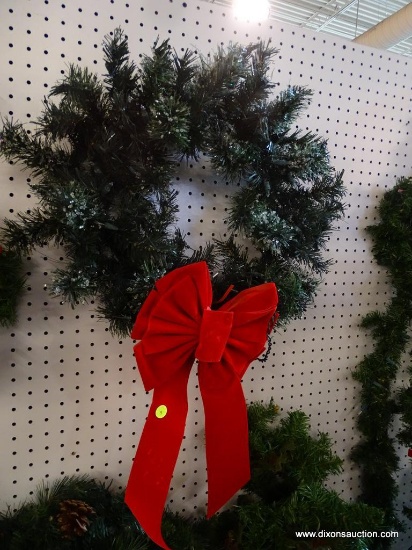 WREATH; GREEN PRE LIT WREATH WITH A BRIGHT RED BOW. MEASURES 20 IN DIA AND IS READY FOR YOUR FRONT