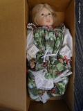 ROYAL VIENNA DOLL; IN GREEN FLORAL DRESS WITH BLONDE HAIR AND BROWN EYES. IN THE ORIGINAL BOX!