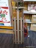 RUSTIC VINTAGE SNOW SLED; MADE OF WOOD WITH METAL RAILS, MEASURES 56 IN LONG. SHOWS A BIT OF WEAR