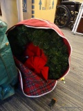 WREATH; PINE THEMED WREATH WITH BRIGHT RED BOW. MEASURES 22 IN DIA. IS IN REUSABLE RED CLOTH WREATH