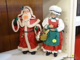 PAIR OF CLOTHTIQUE MR. AND MRS. CLAUS FIGURINES; 1 OF JOLLY OLD SAINT NICK (MR. CLAUS) WITH A TOY