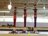 LOT OF 3 CANDLESTICK HOLDERS; BRUSHED METAL AND RED PAINTED IN COLOR. TALLEST STANDS 11.5 IN TALL