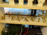 LOT OF 13 BRASS REINDEER FIGURINES. TALLEST IS A CANDLE HOLDER AND IS 8 IN TALL