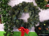 WREATH; GREEN PRE LIT WREATH WITH A BRIGHT RED BOW. MEASURES 18 IN DIA AND IS READY FOR YOUR FRONT