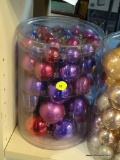 ORNAMENT CONTAINER LOT; FILLED TO THE VERY TOP WITH PURPLE AND PINK CHRISTMAS ORNAMENTS