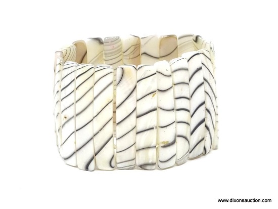 FEATHERED MOTHER OF PEARL EXPANSION BRACELET. ONE SIZE FITS ALL. APPROX. 2" WIDE. VERY VERSATILE.