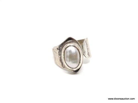 NATIVE AMERICAN MOTHER OF PEARL AND STERLING, ONE SIZE FITS ALL RING. SIGNED DTR. HAS A MID-CENTURY