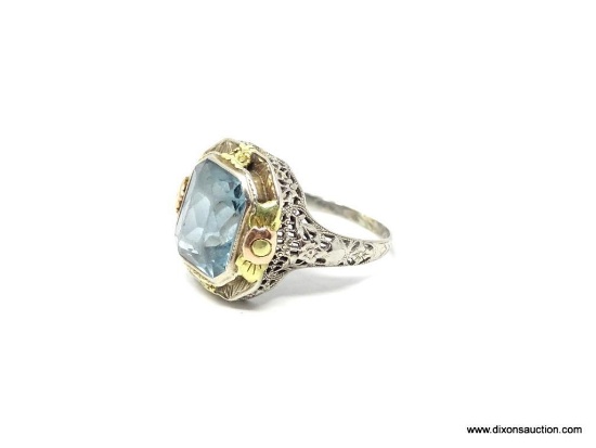 14K WHITE GOLD ANTIQUE FILIGREE BLUE TOPAZ RING. STONE IS BEZEL SET AND ACCENTED ON FOUR SIDES WITH