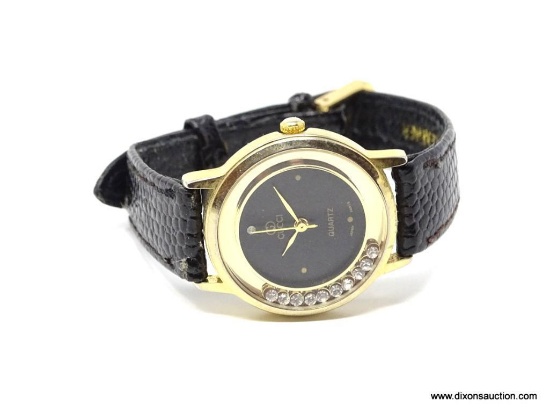 GUCCI DESIGNER WRISTWATCH WITH 10 FLOATING BEZEL SET CLEAR STONES. BLACK LEATHER BAND. IN GOOD