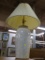 MARBLE LOOK TABLE LAMP; LARGE TABLE LAMP WITH A CREAM COLORED PLEATED BELL SHAPED SHADE SITTING ATOP