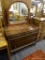 ANTIQUE WOODEN DRESSER; ARCHED MIRROR ON A BEAUTIFULLY CARVED STAND THAT HAS TURNED POSTS, ATTACHED